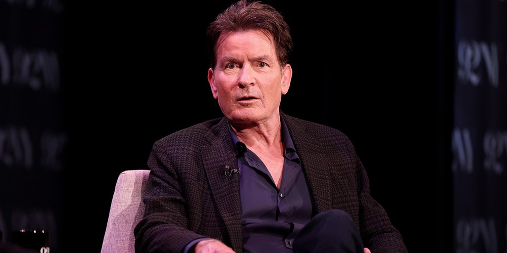 Charlie Sheen seated