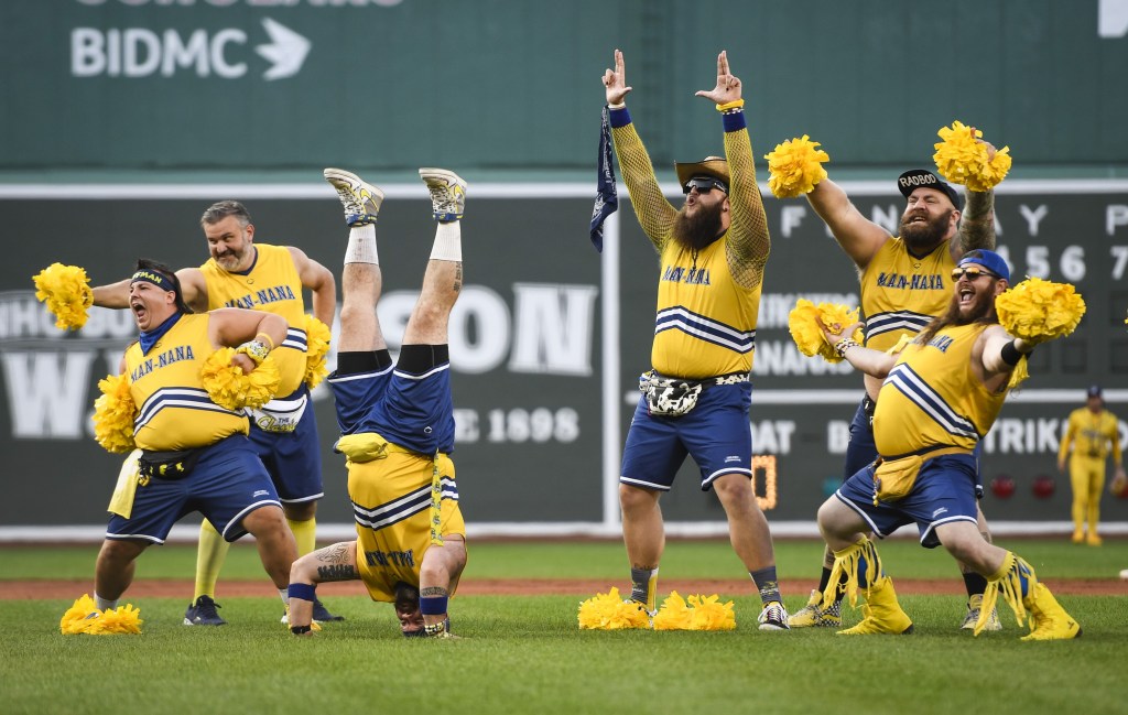 Man‑Nana crew dancing during a game