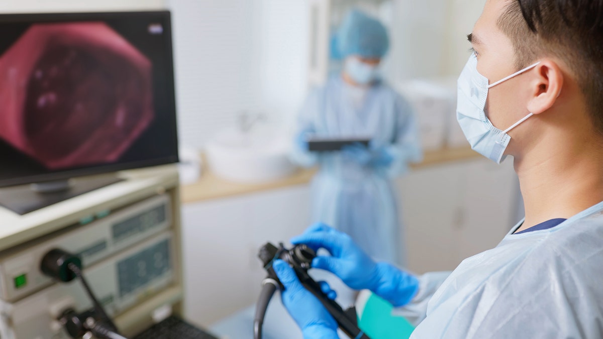 doctor performing colonoscopy
