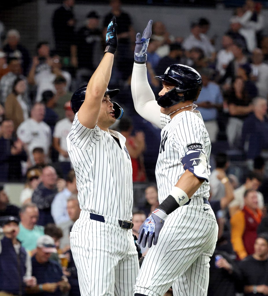 Aaron Judge reacts as President Donald Trump stands nearby during the seventh-inning stretch