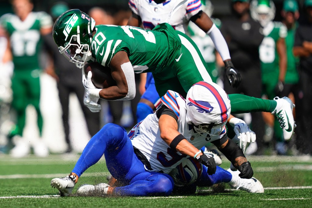 Breece Hall is tackled during the Jets-Bills game