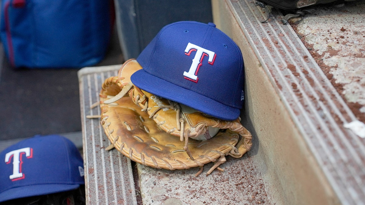 Texas Rangers hat and glove in dugout 2