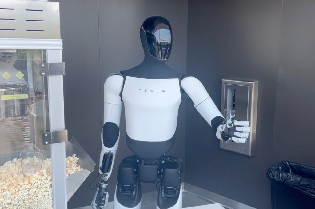 A robot staff member serves popcorn