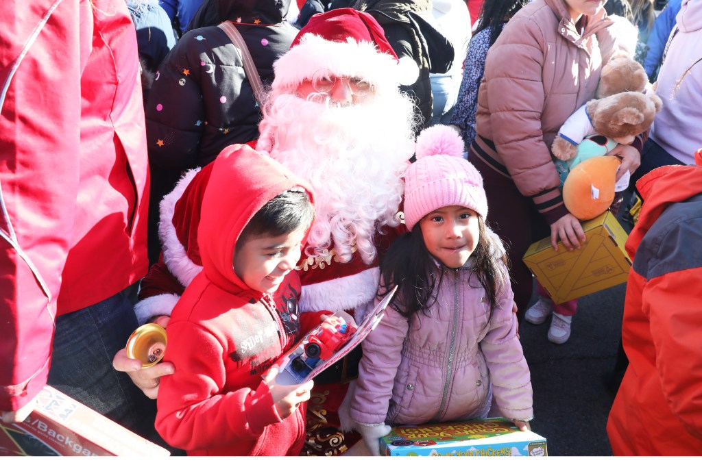 Costumed officers greet children during the toy drive