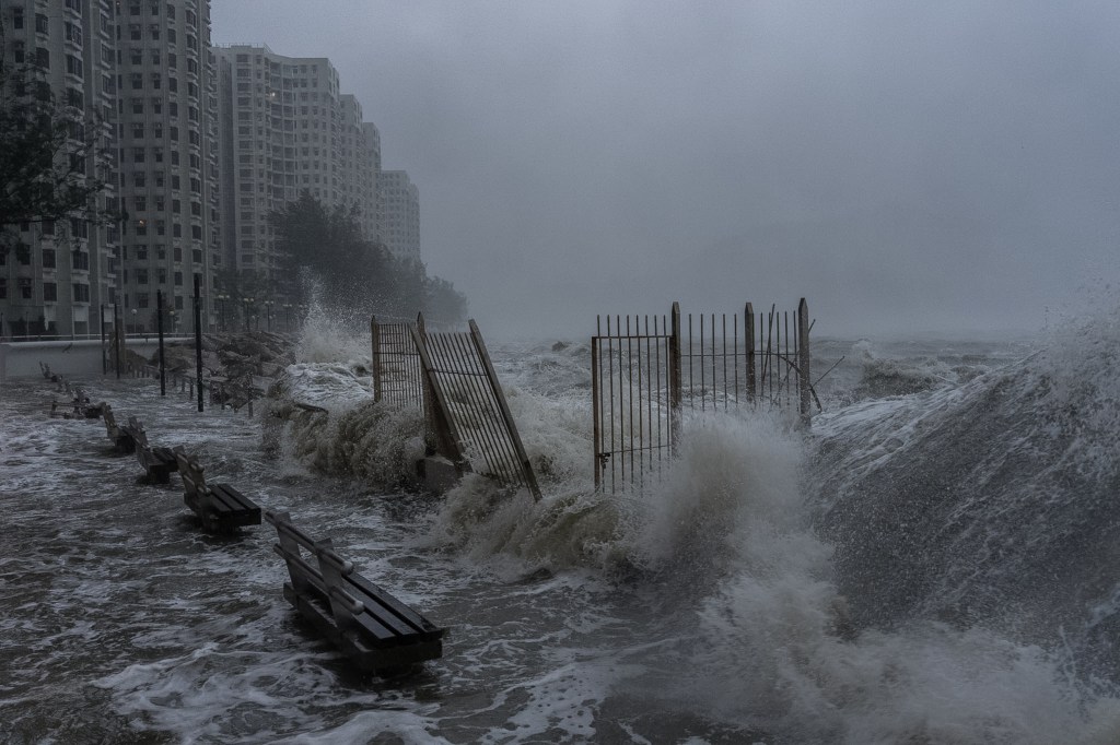 Waves crash against the waterfront in Heng Fa Chuen as Ragasa nears Hong Kong