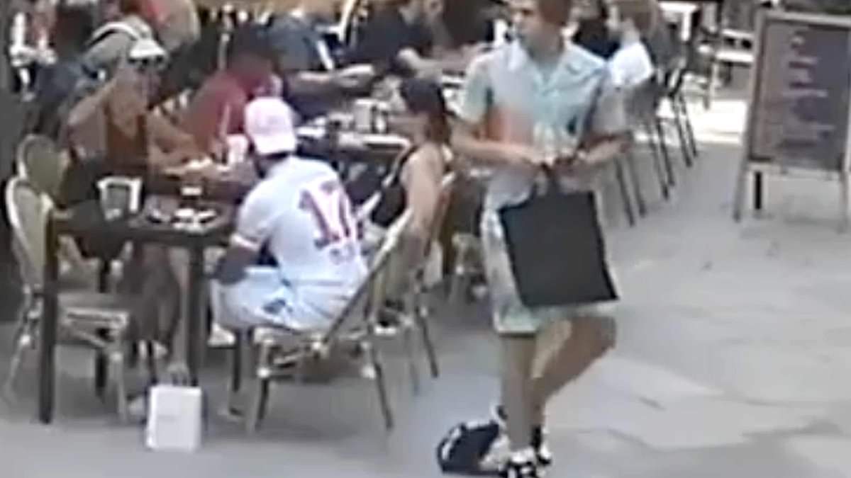 Brazen Barcelona bag theft caught on camera as thief drags bag with foot in crowded square