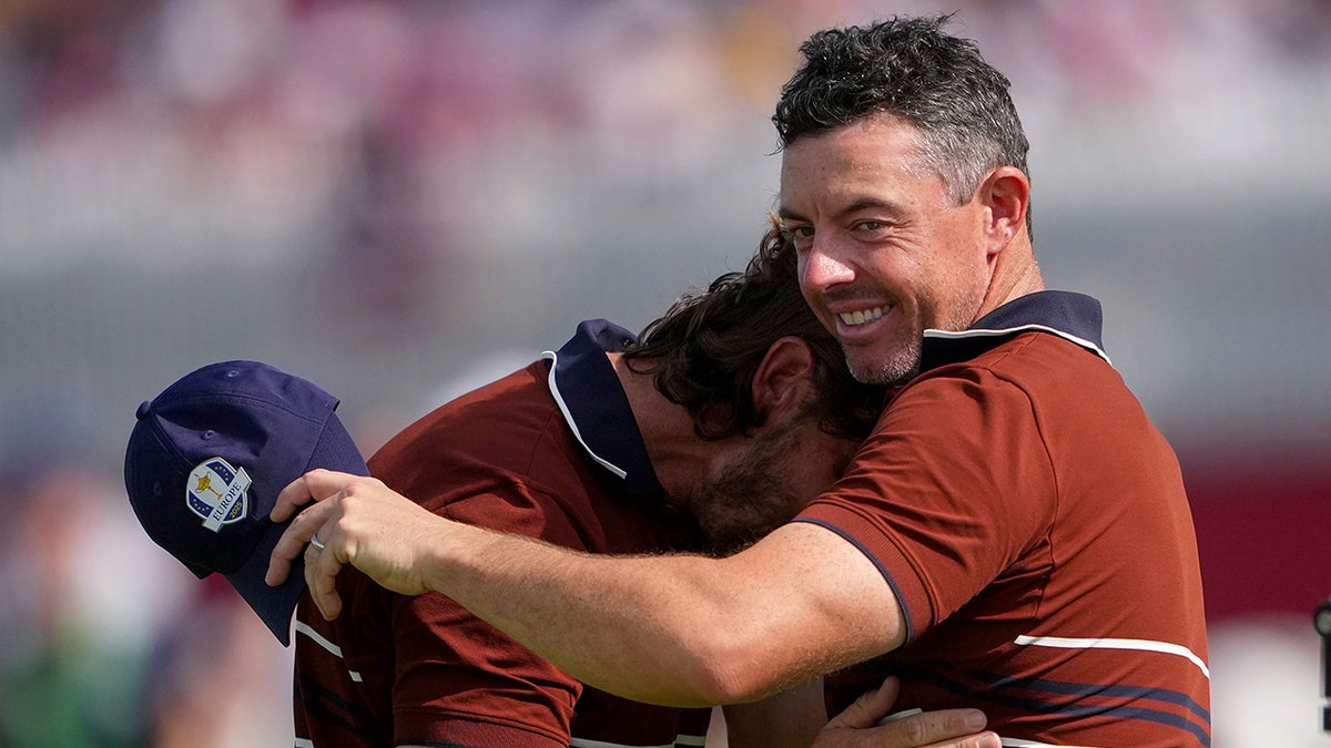 Rory McIlroy embraces Tommy Fleetwood