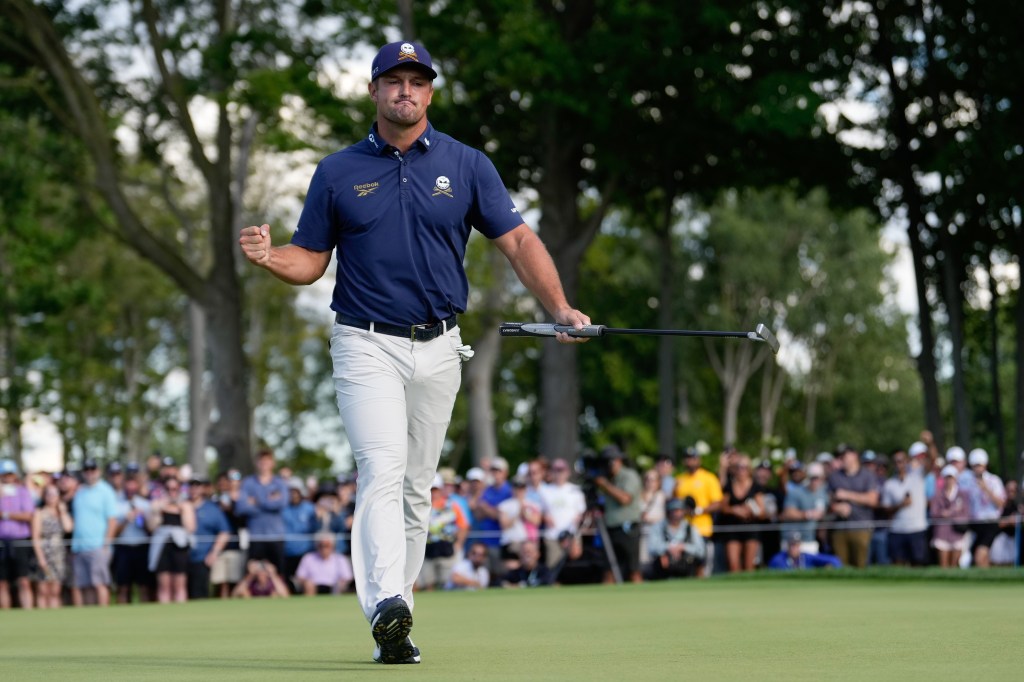 Bryson DeChambeau celebrates