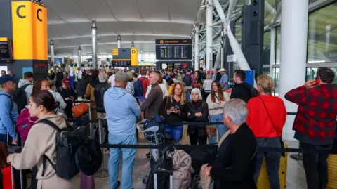 Heathrow braces for second day of disruption after cyber-attack on check-in system