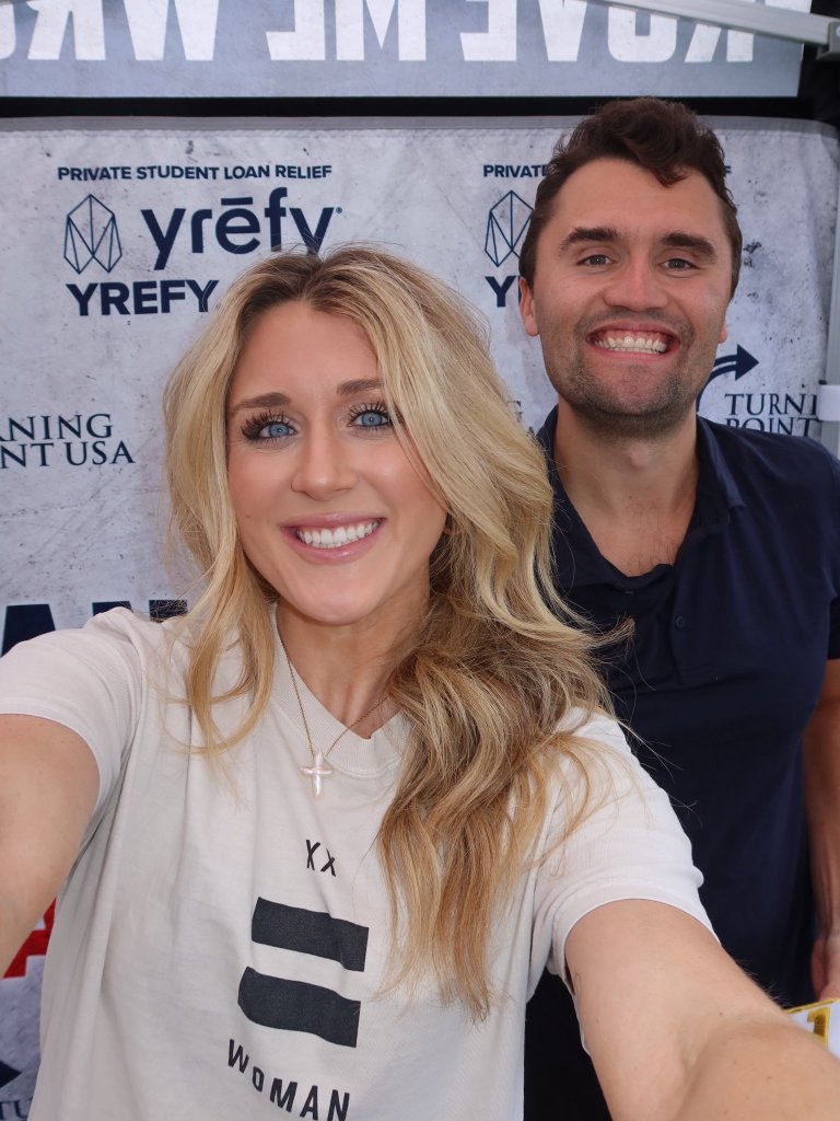 Riley Gaines speaking at a campus event with security