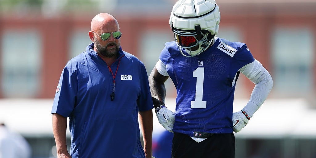 Brian Daboll and Malik Nabers talk during training camp