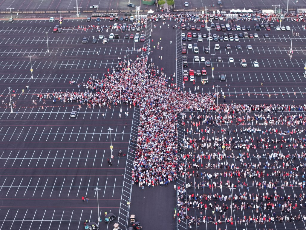 Drone view shows people arrive
