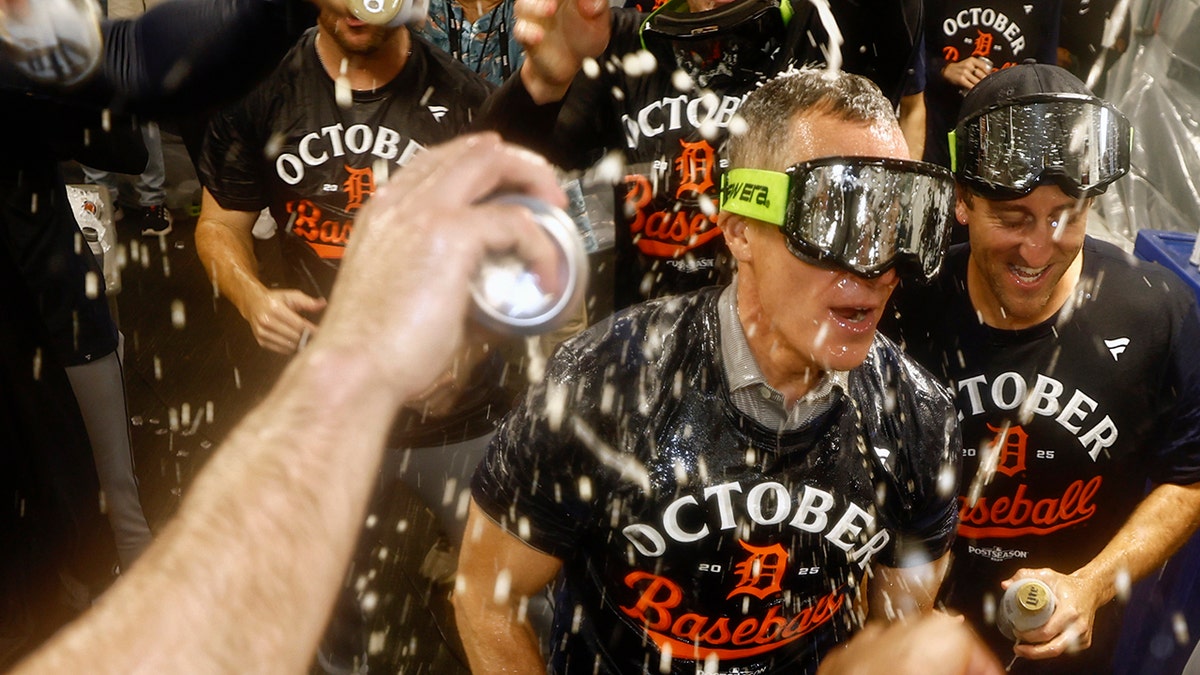 Chris Ilitch doused with beer