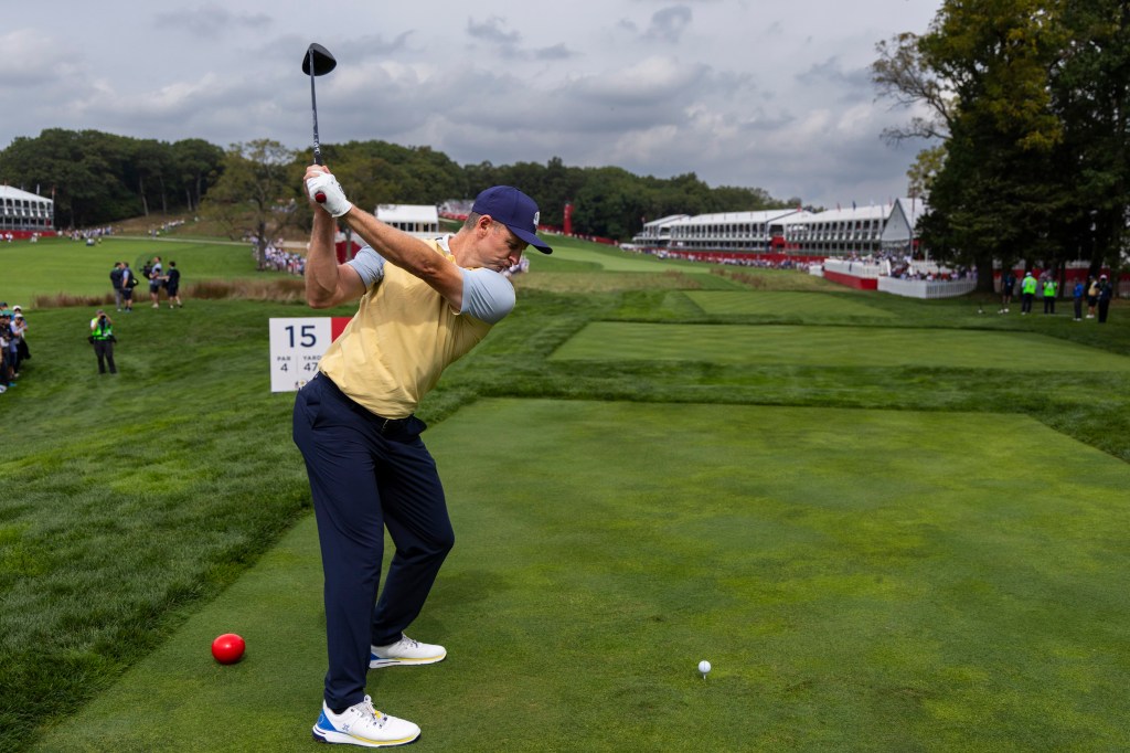 Justin Rose tees off during practice