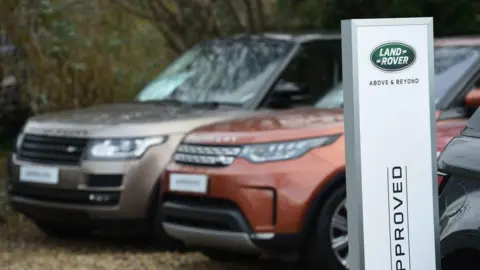 Jaguar Land Rover halts UK production after cyber-attack as hackers claim responsibility