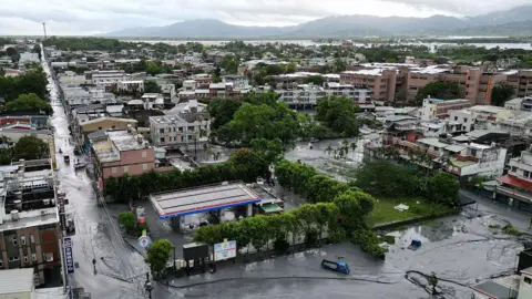No warning: Deadly flood follows typhoon-burst barrier lake in Taiwan