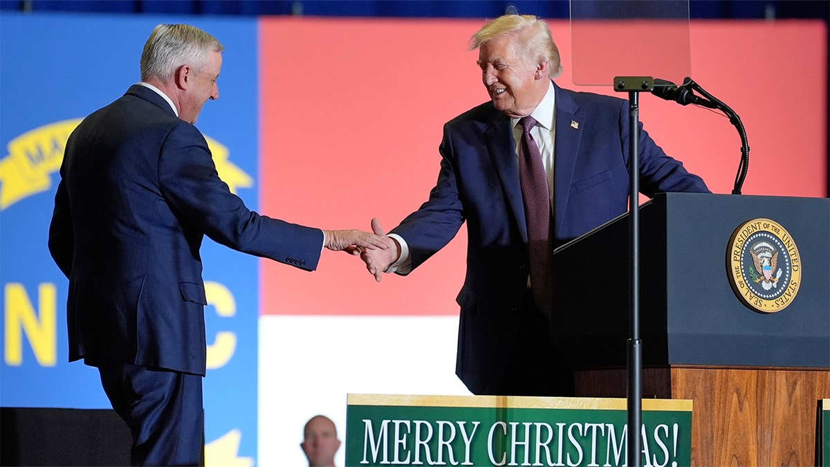 Donald Trump and Michael Whatley at a campaign event in Rocky Mount, North Carolina, Dec. 19, 2025