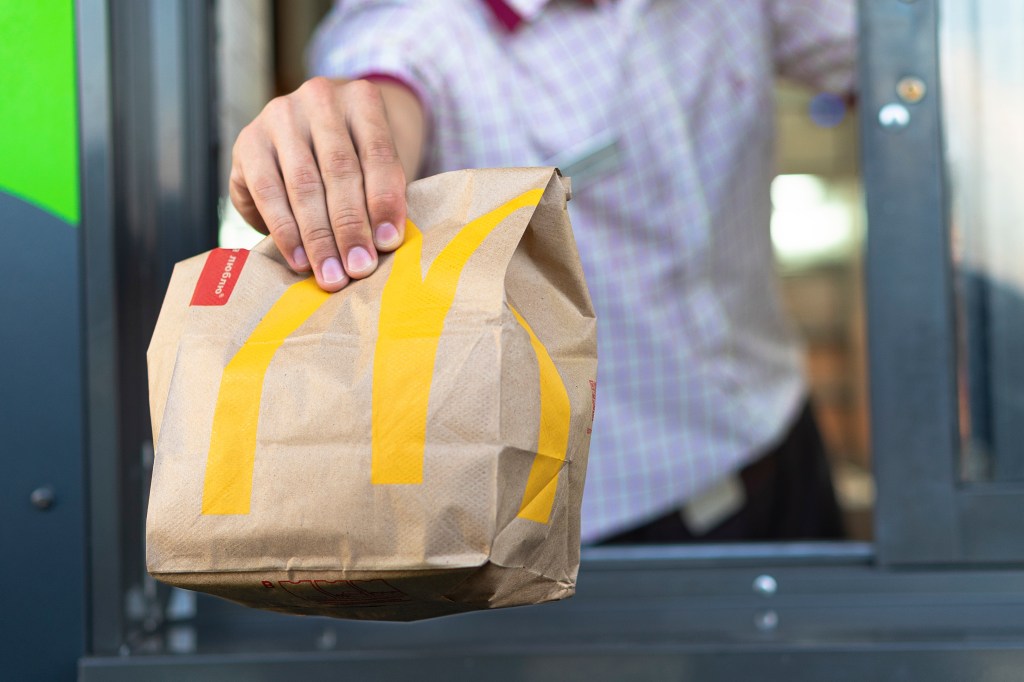 McDonald’s worker holding a delivery bag