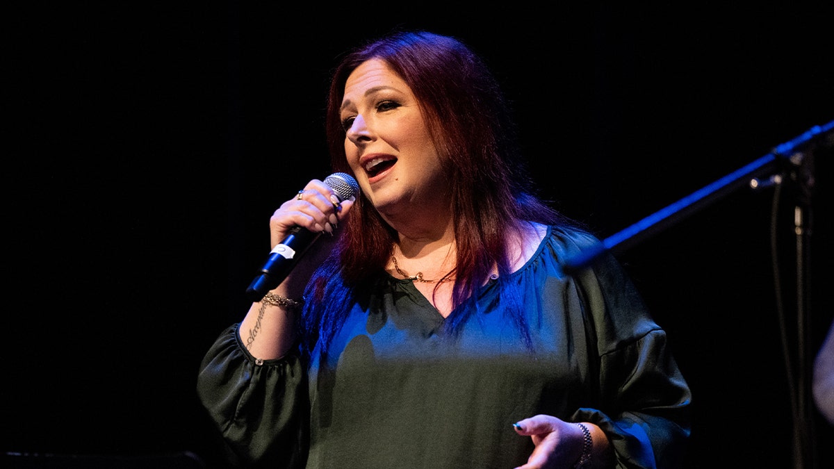Carnie Wilson singing in a red dress
