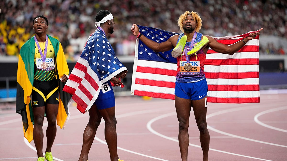 Noah Lyles with American flags