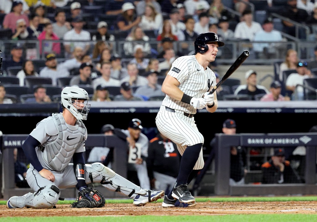 Giancarlo Stanton follows through on his home run swing