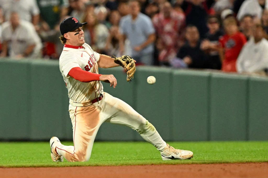 Red Sox second baseman throws to first