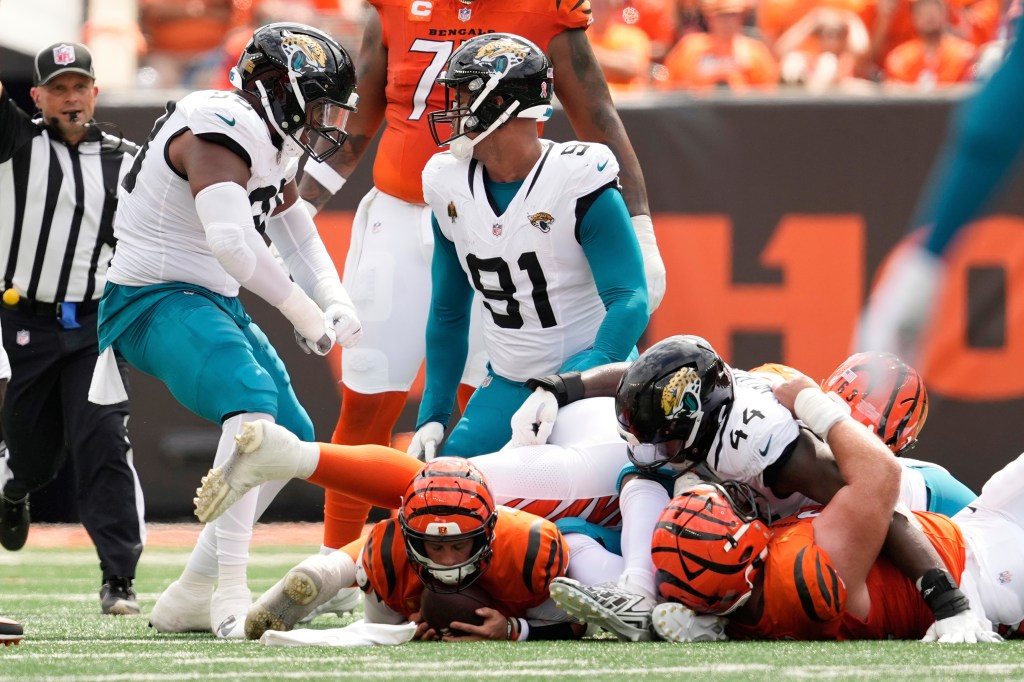 Burrow after play, leaving the field