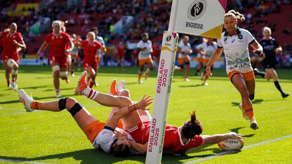 Alysha Corrigan dives to score