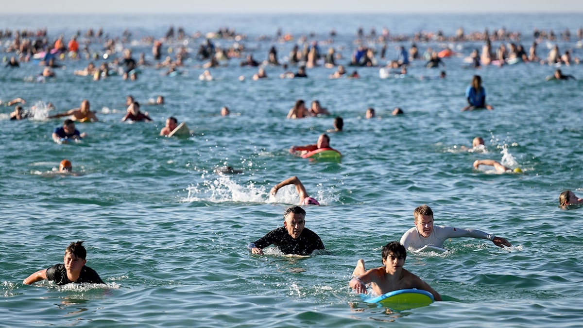 Bondi Beach reopens, surfers at the scene as Hanukkah observances continue