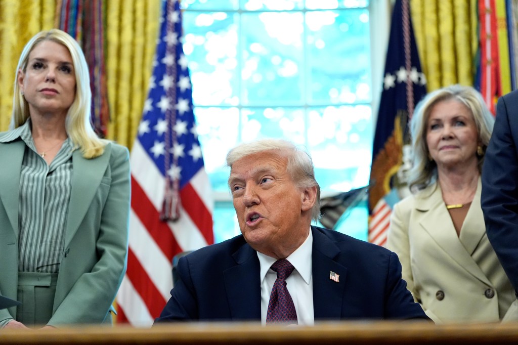 Trump speaks at a podium