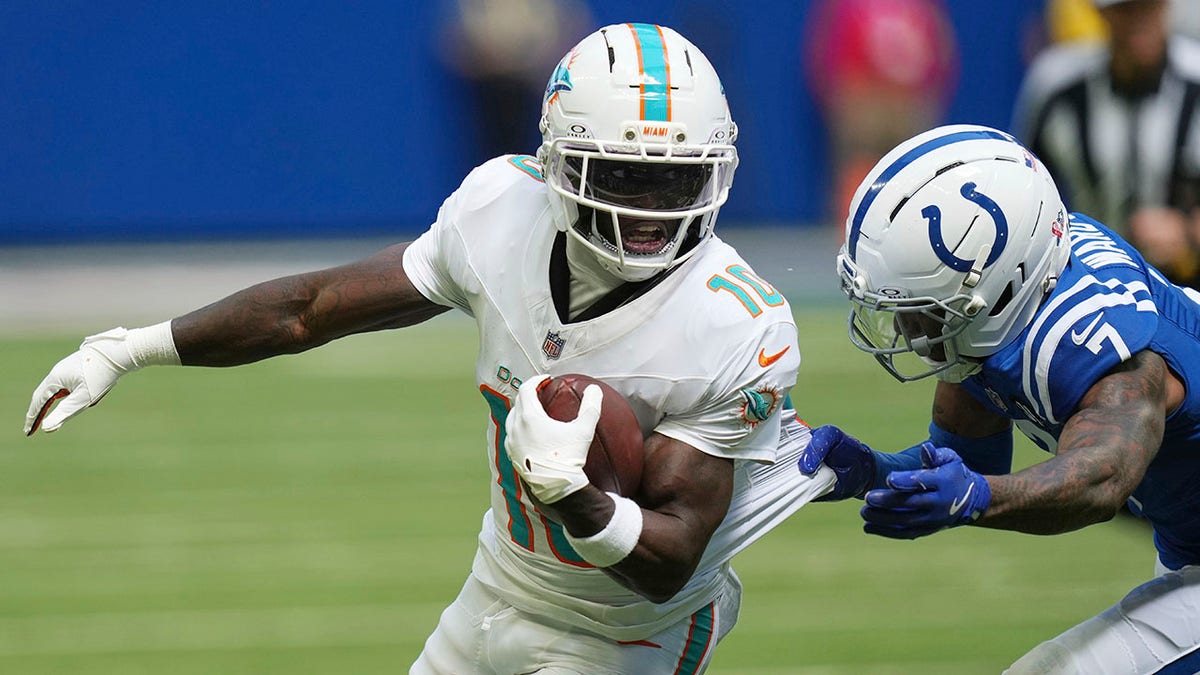 Tyreek Hill tackled during a game