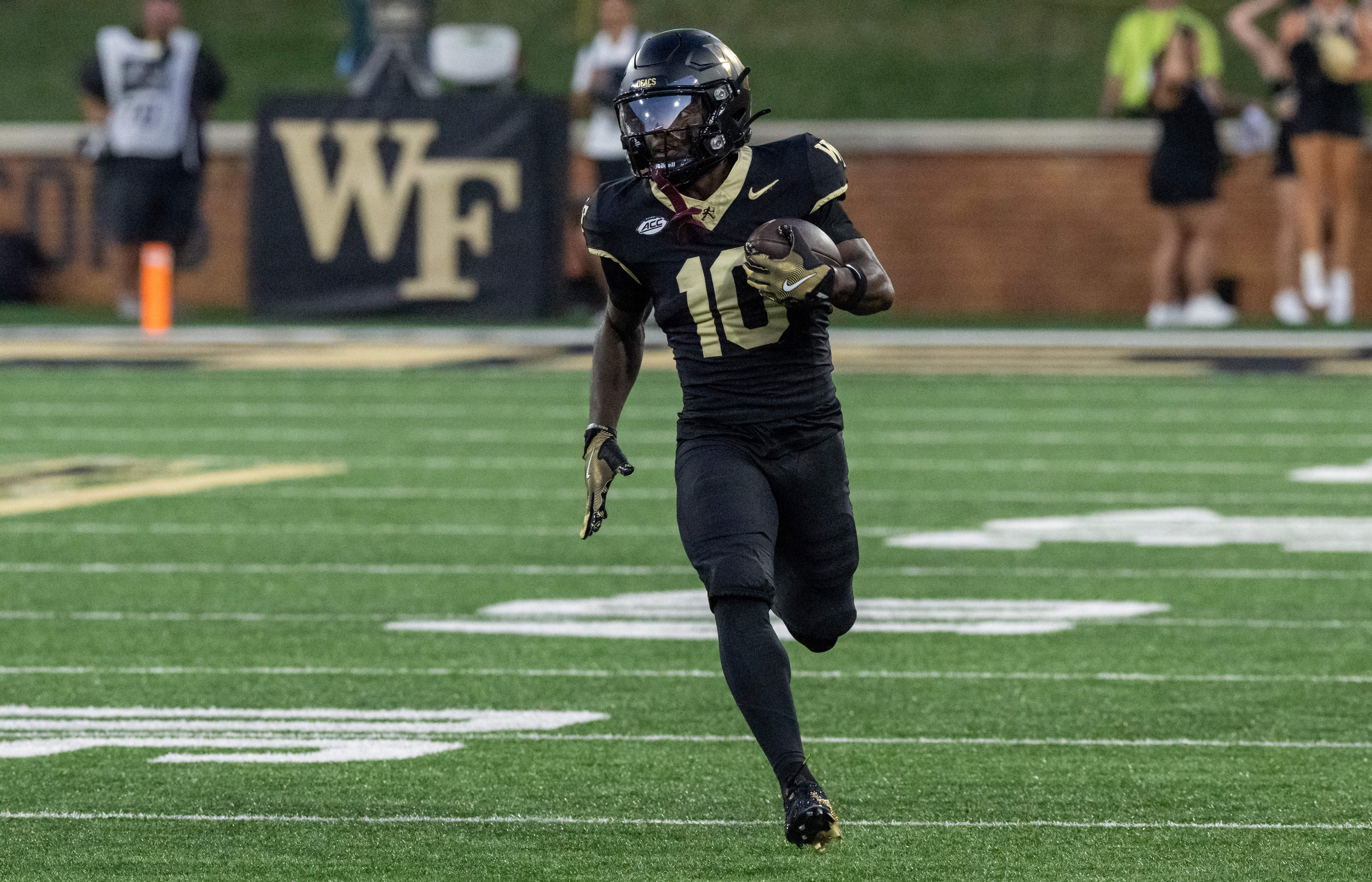 Wake Forest returner Chris Barnes running with the football